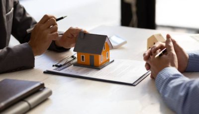 Real estate agent discuss about the terms of the home purchase agreement and asked the customer to sign the documents to make the contract legally, Home sales, lease, mortgage and home insurance.
